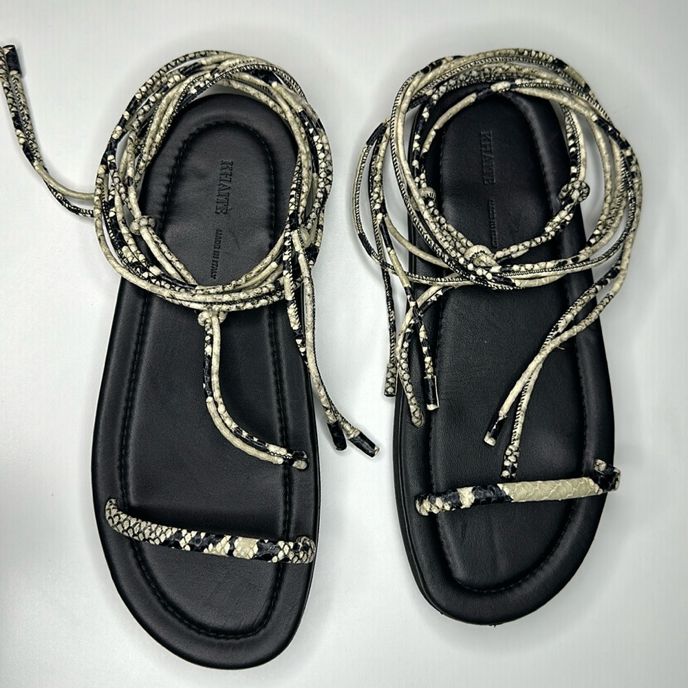 KHAITE Black Leather Lace-Up Sandals with Snake-Print Straps